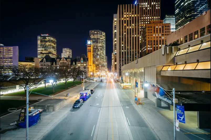 A street level view of downtown Toronto, Queen Street West in front of City Hall.